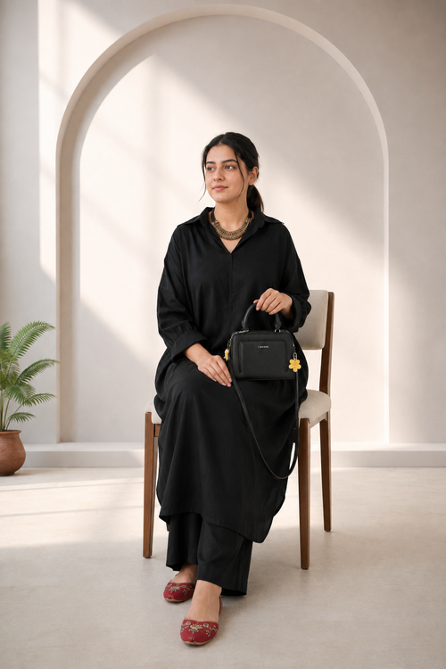 Close-up of black pure lawn kurta with collared neckline and contrast stitching