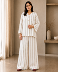 Model wearing ivory-beige linen 2-piece co-ord set with multicolour vertical stripes