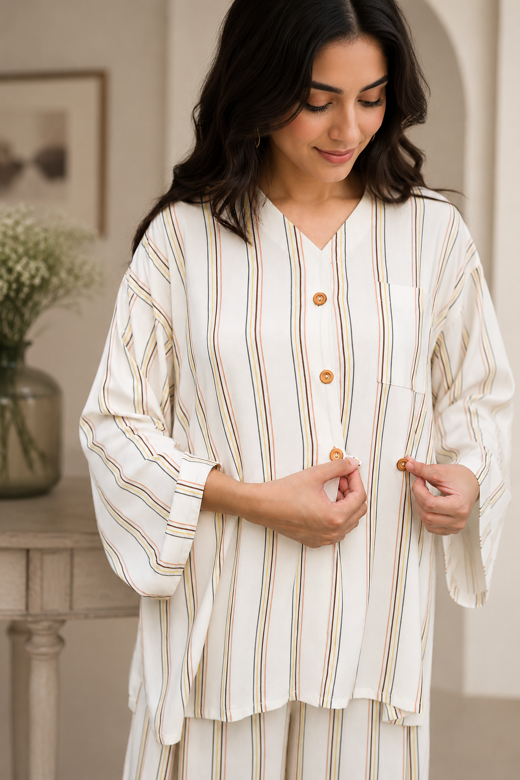 Close-up of the striped linen co-ord set chest pocket and premium stitching