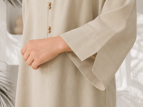 Close-up of cuff slit detailing on ivory beige linen sleeve
