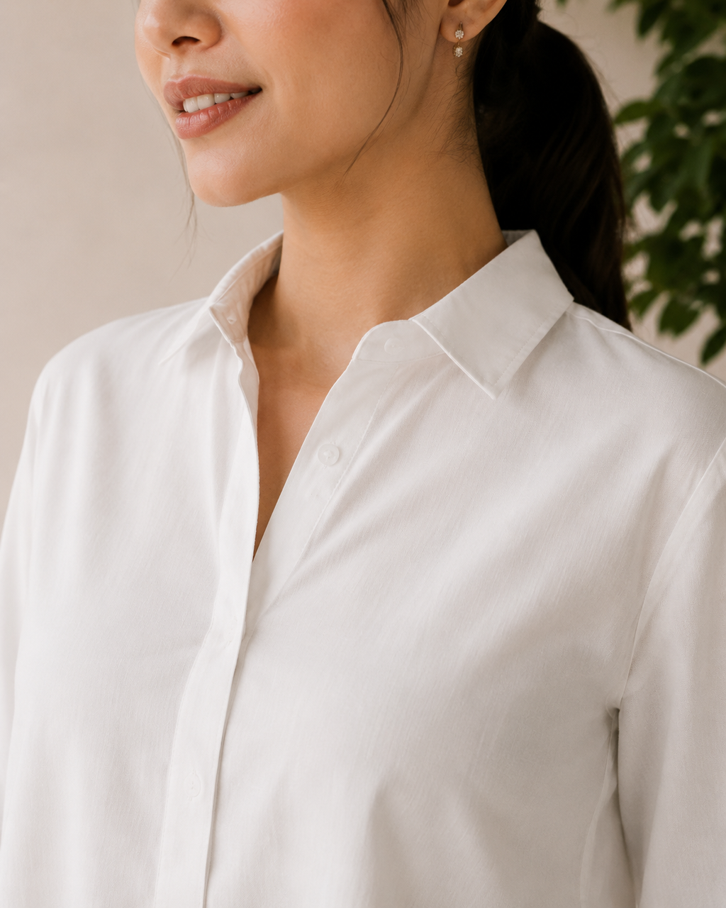 Close-up of the ivory linen shirt sleeve with cuff slit detailing