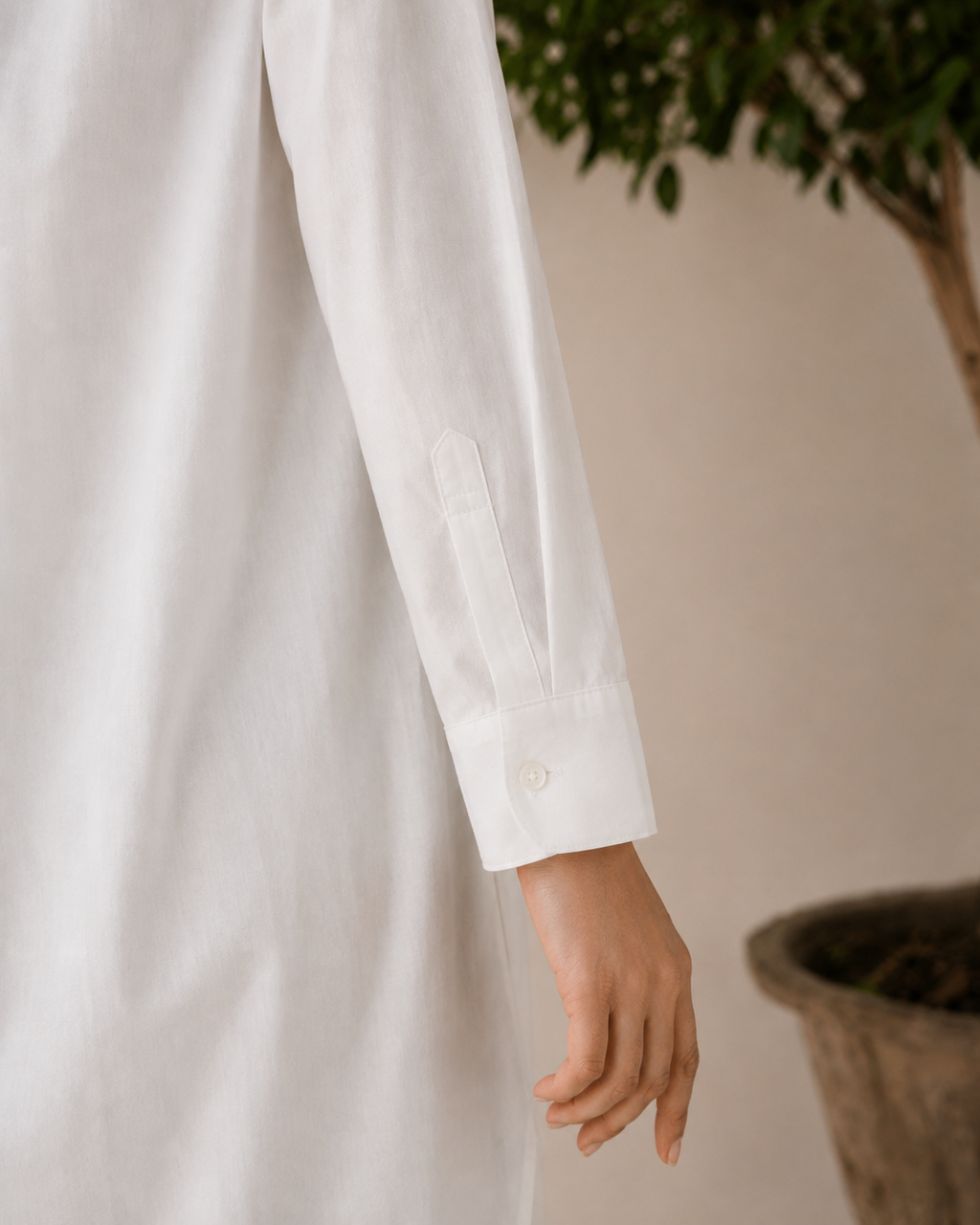 Model wearing the ivory linen 2-piece co-ord with straight-leg trousers